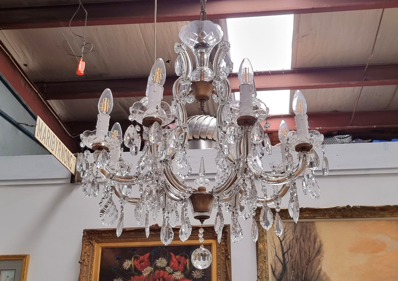 Sourced From France an attractive eight arm French crystal chandelier. It has been fully rewired to Australian standards and is in good original working condition.