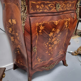 Stunning French Transitional style Mahogany marquetry inlay salon cabinet in the bombe shape. It has one draw, one shelf, marble top & ormolu decoration. Sourced from France and in good original detailed condition.