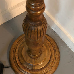 Tudor style Oak standard lamp, rewired and with foot switch. In good original condition.