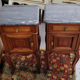 Pair of Walnut Louis XV style grey marble top bedside cabinets. Single drawer, one cupboard and lovely French cabriole legs. They have been sourced from France and are in good original condition.