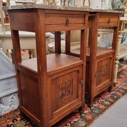 Charming pair of French Oak Arts and Crafts bedsides with shelf, cupboard with carving and marble top.  They have been sourced from France and are in good original detailed condition.