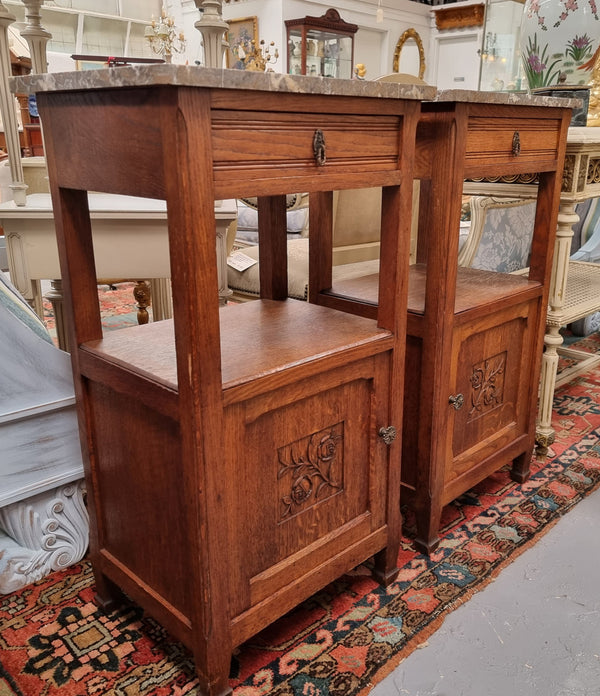 Charming pair of French Oak Arts and Crafts bedsides with shelf, cupboard with carving and marble top.  They have been sourced from France and are in good original detailed condition.