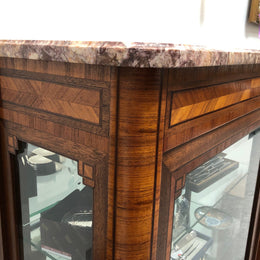Beautiful French walnut and parquetry inlaid vitrine with lovely bevelled glass and a marble top. It comes with four glass shelves which are adjustable and it is in good original condition.