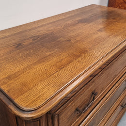 French solid Oak Louis 14th style chest of three drawers. It has three large spacious drawers and it has been sourced from France. It is in good original detailed condition.