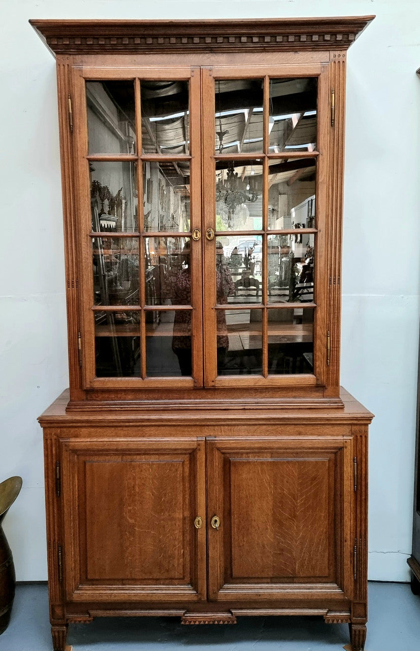 Beautiful 19th Century French Oak four door bookcase with 3 adjustable shelves and 1 fixed shelf in good detailed original condition.