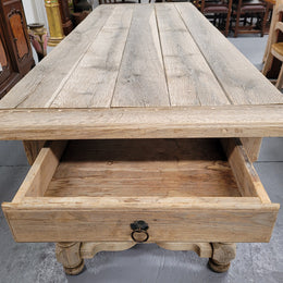 French stripped Oak pedestal stretcher base Farmhouse table with two drawers on either side of table. Features raw wood that could be used as is for a distressed look, or finished and waxed for a more refined look.