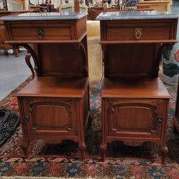 Pair of unusual transitional fruit wood marble top bedside cabinets. They have been sourced from France and are in good original detailed condition.