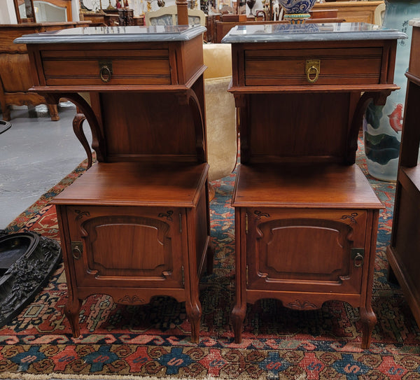 Pair of unusual transitional fruit wood marble top bedside cabinets. They have been sourced from France and are in good original detailed condition.