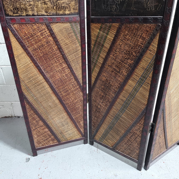 Vintage three panel room divider with elephants made from rattan and wood. It has been sourced locally and is in good original condition.