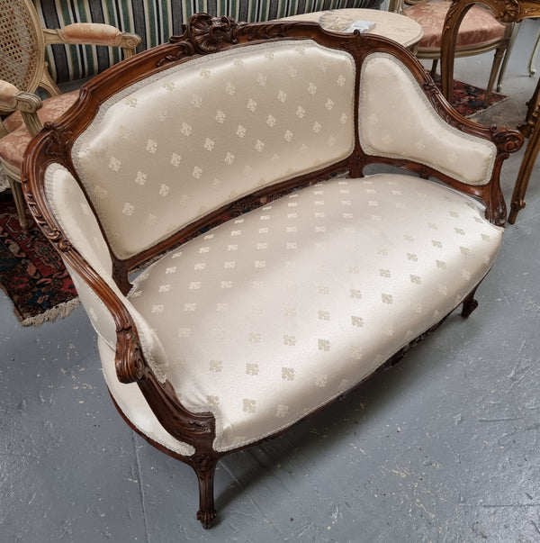 Pretty French Louis XV style small Walnut settee with very good upholstery. Sourced from France and in good original condition, please view photos of the upholstery as it helps form part of the description.