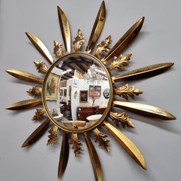 Stunning French Vintage gilt metal starburst convex mirror. It has been sourced from France and in good original detailed condition. Please note mirror does have some spotting due to age but only adds to its character.