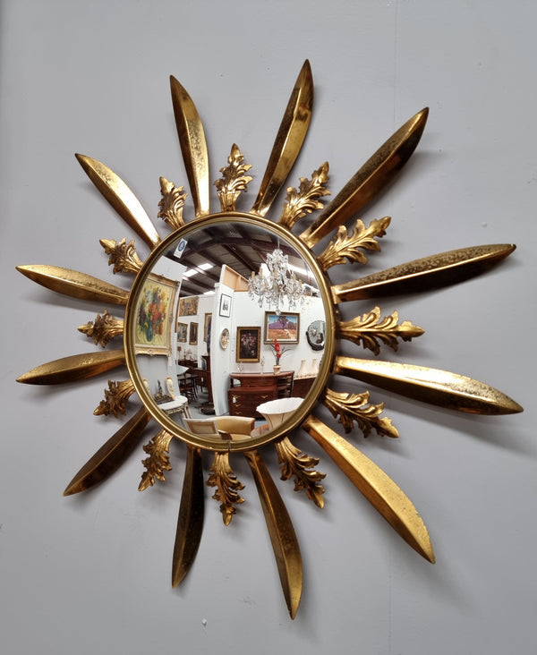 Stunning French Vintage gilt metal starburst convex mirror. It has been sourced from France and in good original detailed condition. Please note mirror does have some spotting due to age but only adds to its character.