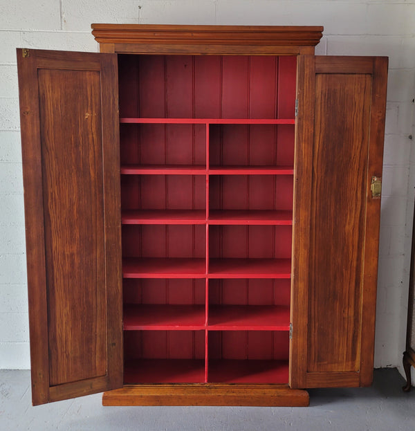 Australian Victorian Pine storage cupboard of pleasing narrow portions. Heaps of storage space and is in very good original detailed condition.