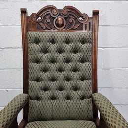 Pair of Edwardian button back Walnut armchairs. They are in good original condition with clean upholstery.