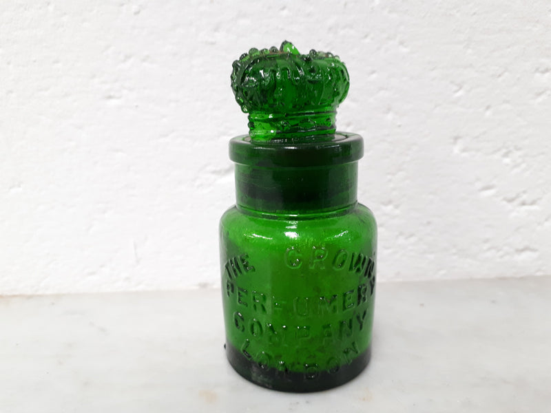 Round Victorian green glass Crown perfume bottle. In good original condition.