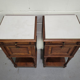 Pair parquetry Walnut bedside cabinets with white inset marble tops. In good original detailed condition.