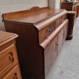 Vintage Walnut Art Deco “Waterfall” sideboard buffet with two drawers and two doors. It is in good original condition and has been sourced locally.