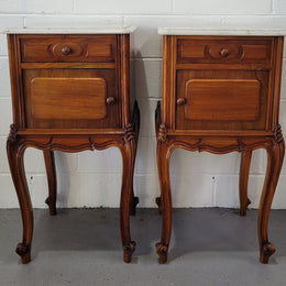 Pair of stunning Louis XV style French Walnut white marble top bedside cabinets. They have one drawer and a cupboard that is marble lined. The marble has been polished and they are in good original detailed condition.