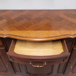 French Oak Louis XV style three drawer three door parquetry top sideboard. It has been sourced from France and is in good original detailed condition.