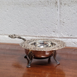 Beautiful and decorative Vintage Dutch Silver (90) tea strainer and stand. In good original condition.