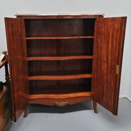 French Louis 15th style Kingwood marquetry inlaid two door cupboard with a beautiful marble top. It has three adjustable shelves and decorative ormolu trim. It has been sourced from France and is in good original detailed condition.
