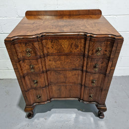 Antique English Figured Walnut inverted serpentine fronted chest of drawers. It is a great quality piece and is in good restored condition.