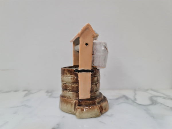 Stunning 19th Century wax match container & striker of girl at the well, it is numbered 4231.