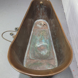 Sourced from France a rare full copper Antique bath tub on feet and includes an overflow, fittings, taps ect. In good original condition.