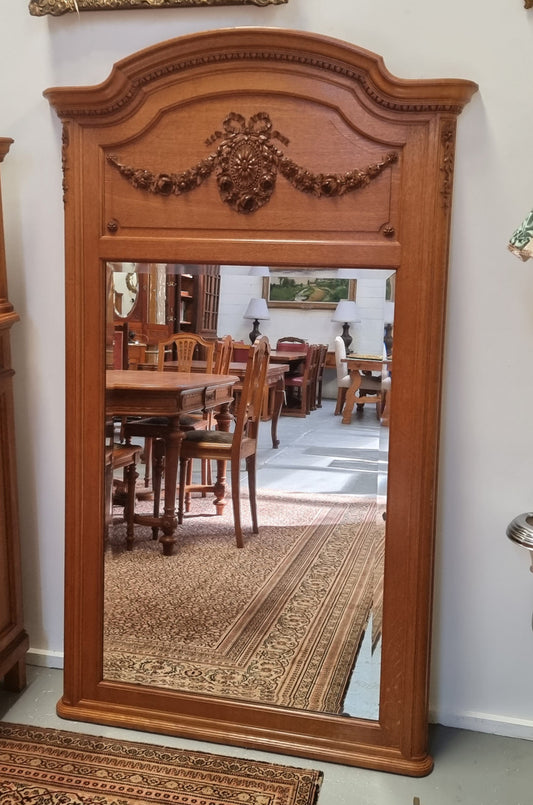 Beautiful French Oak Louis XV style carved trumeau mirror with beautiful detail. In good original detailed condition.