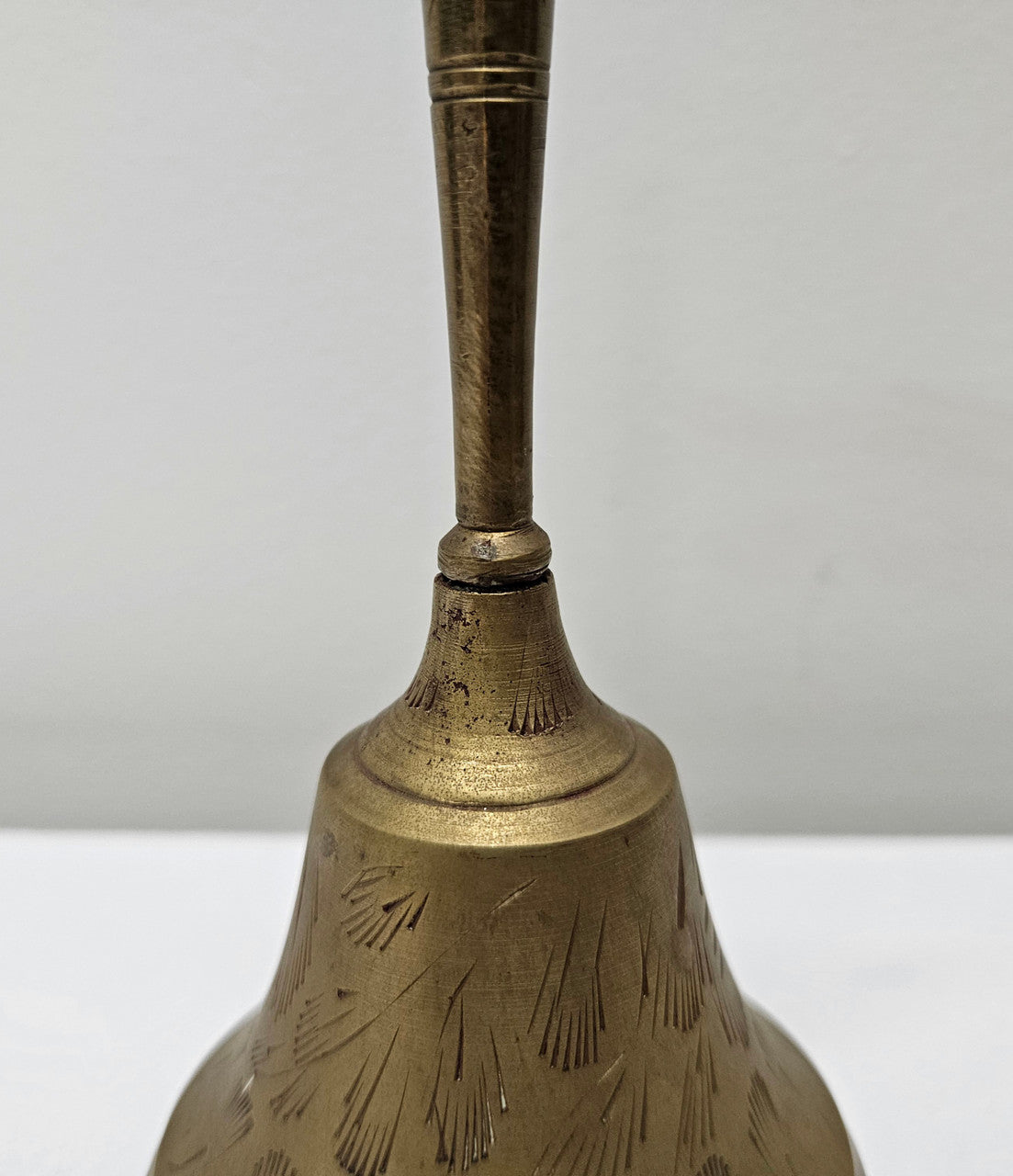 Vintage brass bell with engraved lines and markings on the insde. Please see photos as they form part of the description. In good original condition.