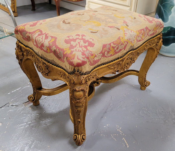 Charming 19th Century gilt wood tapestry covered Louis XV style stool. It has a beautifully carved base and undercarriage and it has been sourced from France. It is in good original detailed condition, please view photos of tapestry has they help form part of the description.