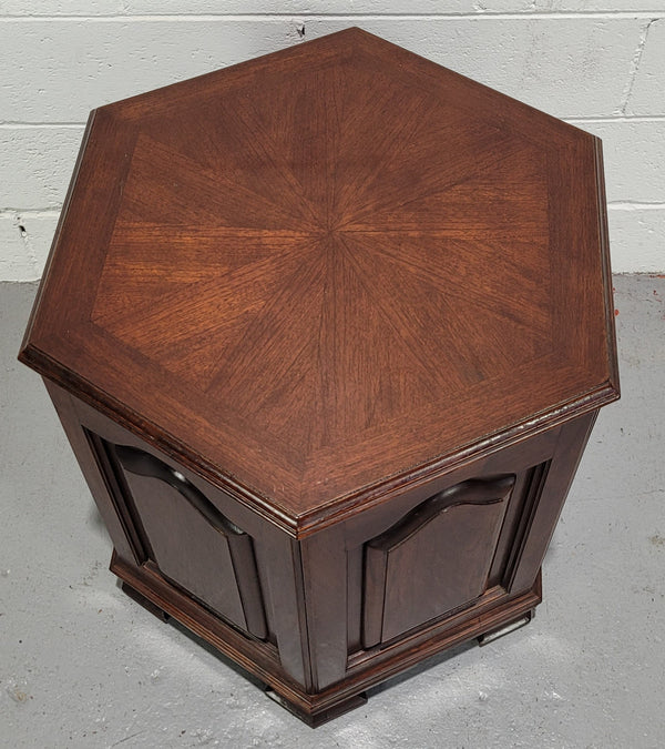 Hexagonal Mahogany enclosed side cabinet with two doors. Would make an ideal side cabinet and is in good restored condition.