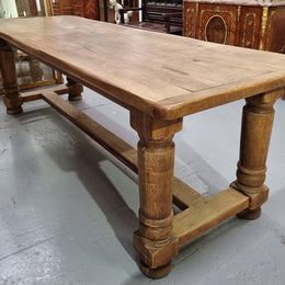 French Oak stretcher base farmhouse table with solid turned legs. It is in good original condition.