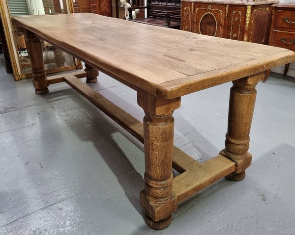 French Oak stretcher base farmhouse table with solid turned legs. It is in good original condition.