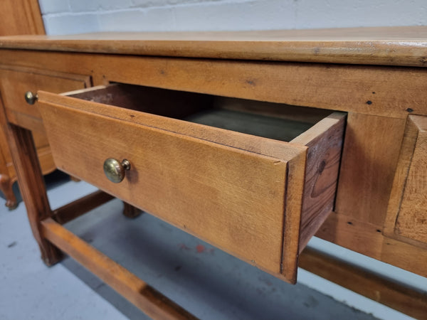 Late 19th Century Cherrywood console table with three drawers. In good used, detailed rustic condition.