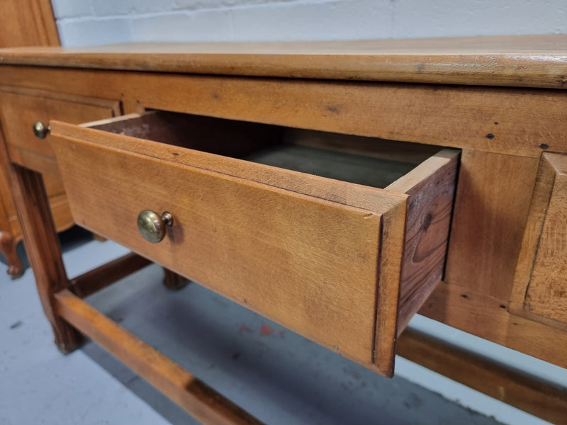 Late 19th Century Cherrywood console table with three drawers. In good used, detailed rustic condition.