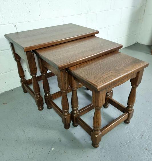 Vintage nest of three French Oak tables. In very good original detailed condition.