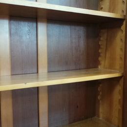 A beautiful Edwardian walnut stained bookcase with lovely carved doors and adjustable shelves. It is 227 cm tall and in very good fully restored condition.