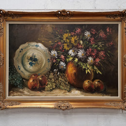 Beautiful signed oil on canvas of a still life framed in an ornate frame. Sourced in France and in good original condition.