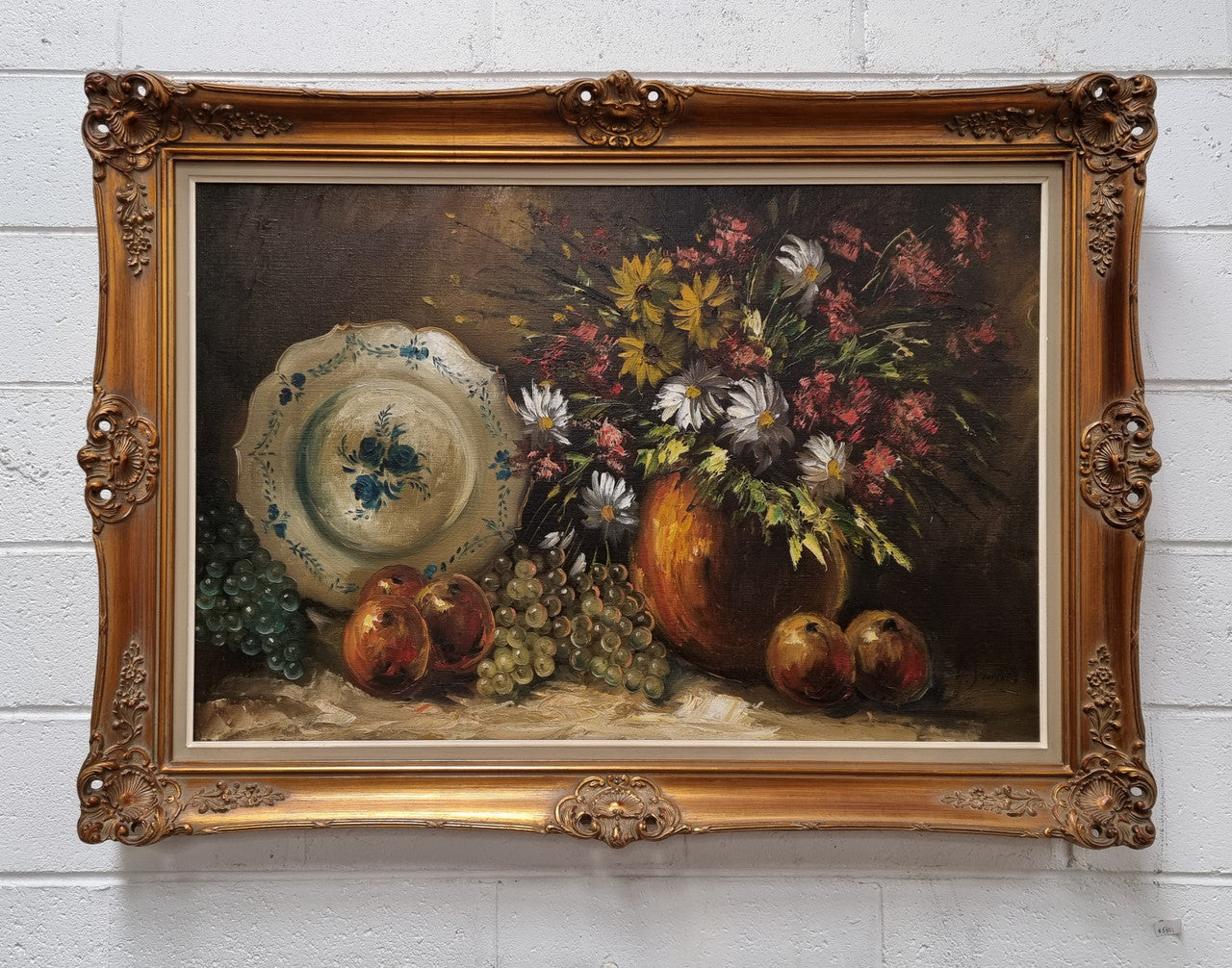 Beautiful signed oil on canvas of a still life framed in an ornate frame. Sourced in France and in good original condition.