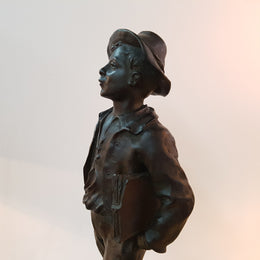 Fabulous French bronze statue of a school boy from the early 20th century. Signed by Marcel Debut ( 1865-1933) and its titled School Boy.