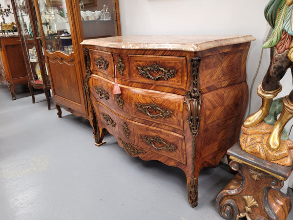 Beautiful French Louis XV style Kingwood inlaid marble top four drawer commode. It has decorative mounts and has been sourced from France. It is in good original detailed condition.