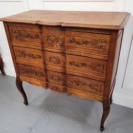 Vintage French dark Oak Louis XV style chest of three drawers. It has beautiful cabriole legs, elegant brass handles and decorative carving throughout. It is in good original detailed condition and has been sourced from France.