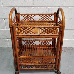 Excellent Vintage Tortoiseshell Bamboo two tier auto trolley. It has been sourced locally and is in fantastic original detailed condition .