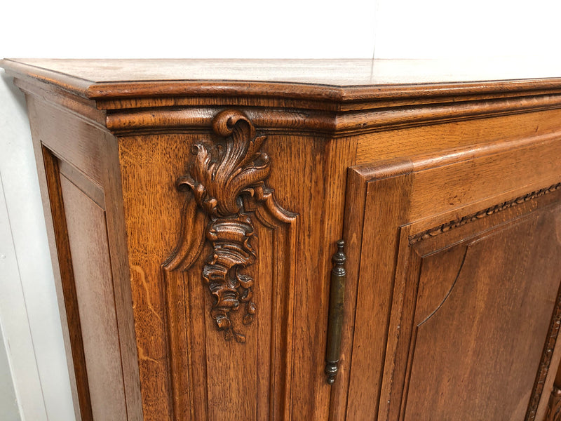 19th century French Oak three door, two drawers buffet with beautiful detailed carving. In good original detailed condition.