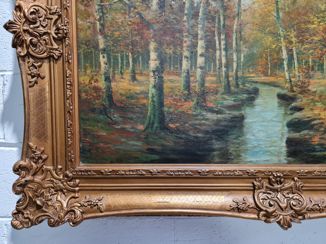 Large French signed oil on canvas painting of Autumn trees on stream scene. In a ornate gilt frame and is in good original condition.