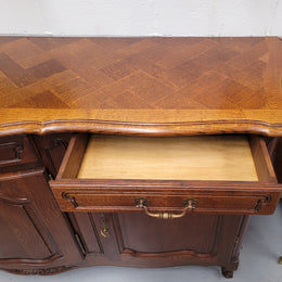 French Oak Louis XV style three drawer three door parquetry top sideboard. It has been sourced from France and is in good original detailed condition.