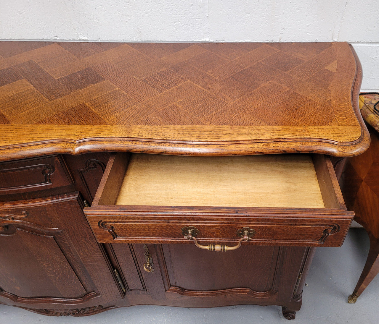 French Oak Louis XV style three drawer three door parquetry top sideboard. It has been sourced from France and is in good original detailed condition.