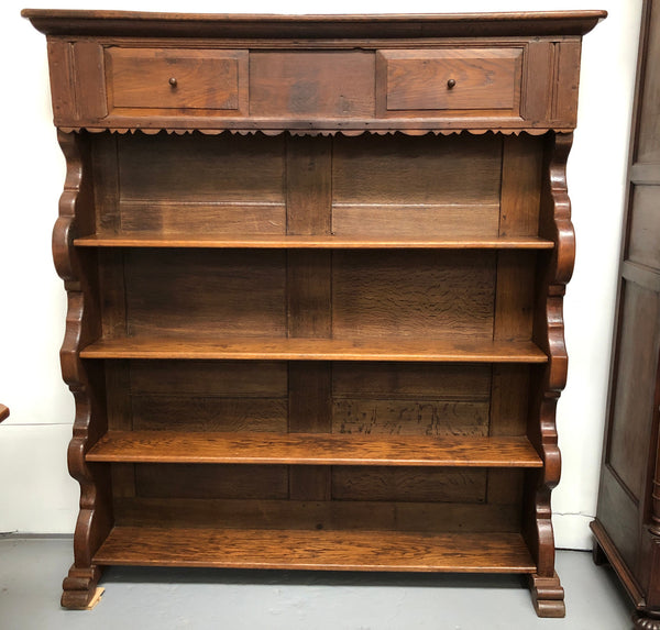Fabulous early 19th century French Oak open shelf bookcase, with four shelves and hidden shelf at the top with two sliding doors. In very good original detail condition.