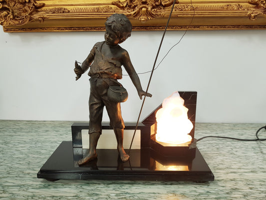An amazing French Art Deco boy fishing statue with a Vaseline light shade. It is in fantastic working condition on a lovely marble base.